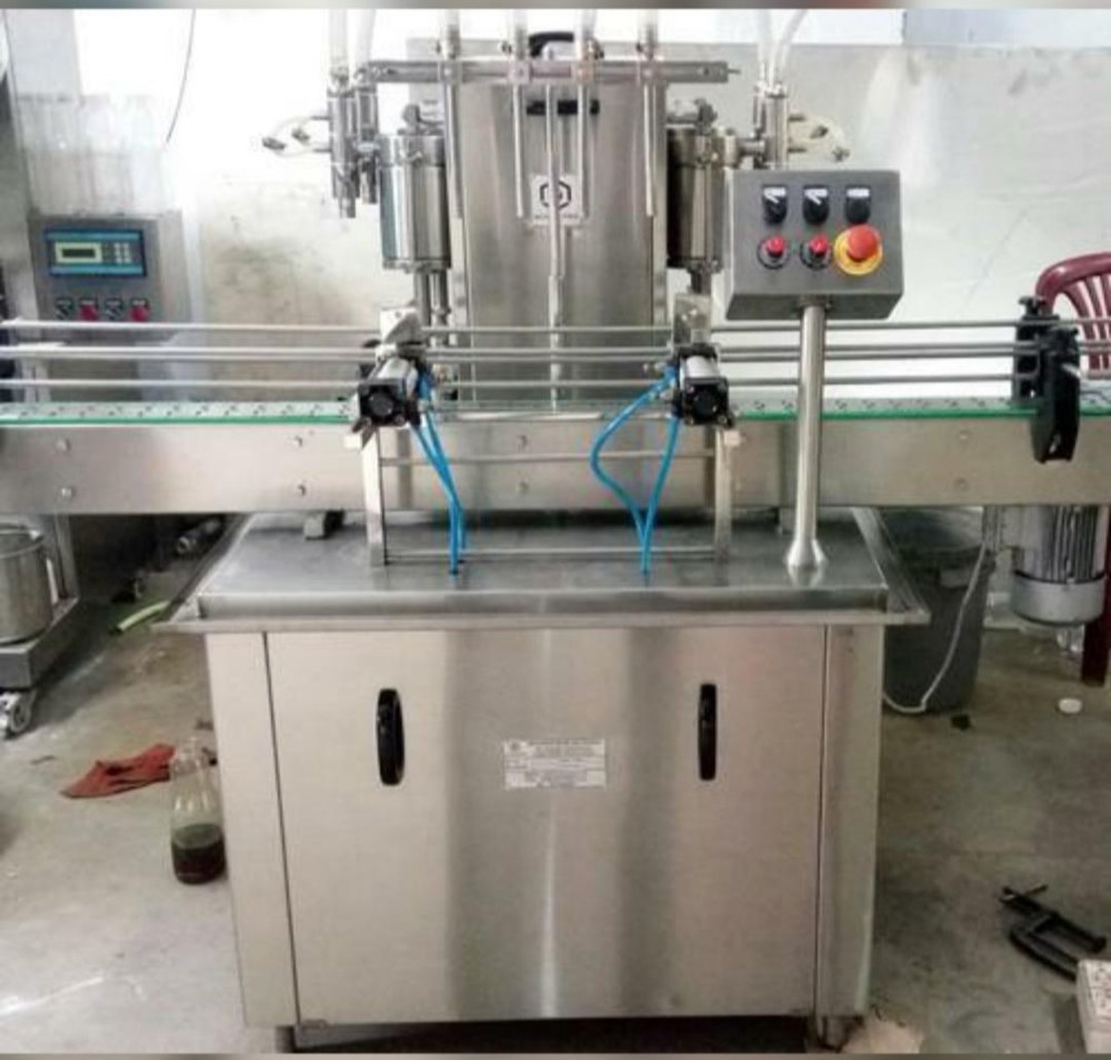 Electric Fully Automatic 4 Head Filling Machine, Packaging Type: Plastic Bottle