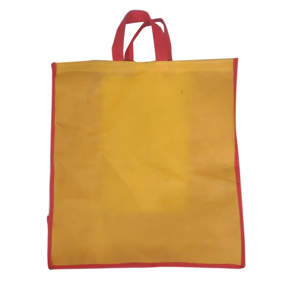 Yellow Loop Handle Non Woven Bag, Capacity: 15kg